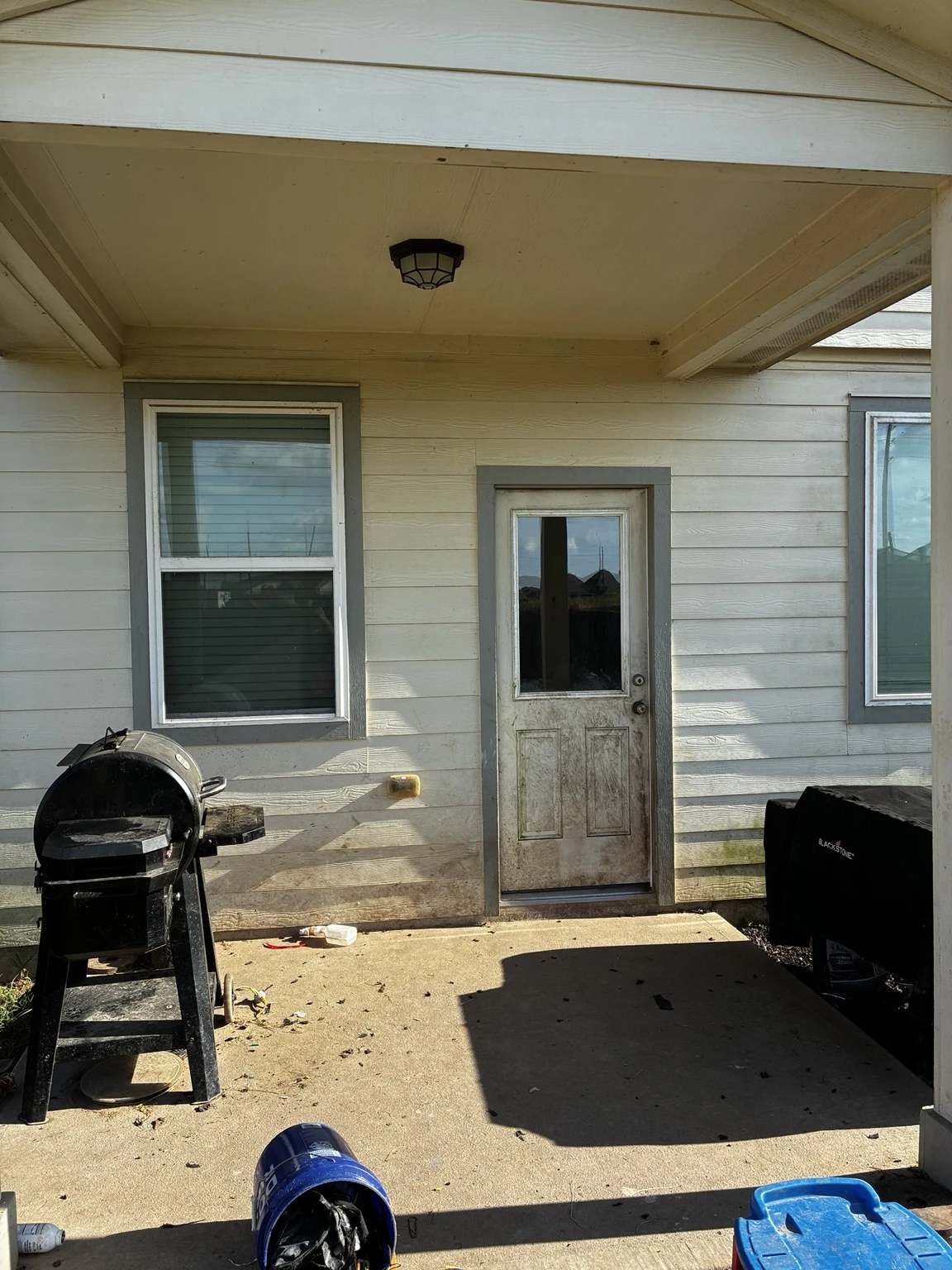 House & covered-entry washing before cleaning or restoration